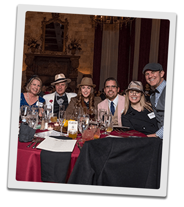 Los Angeles Murder Mystery party guests at the table