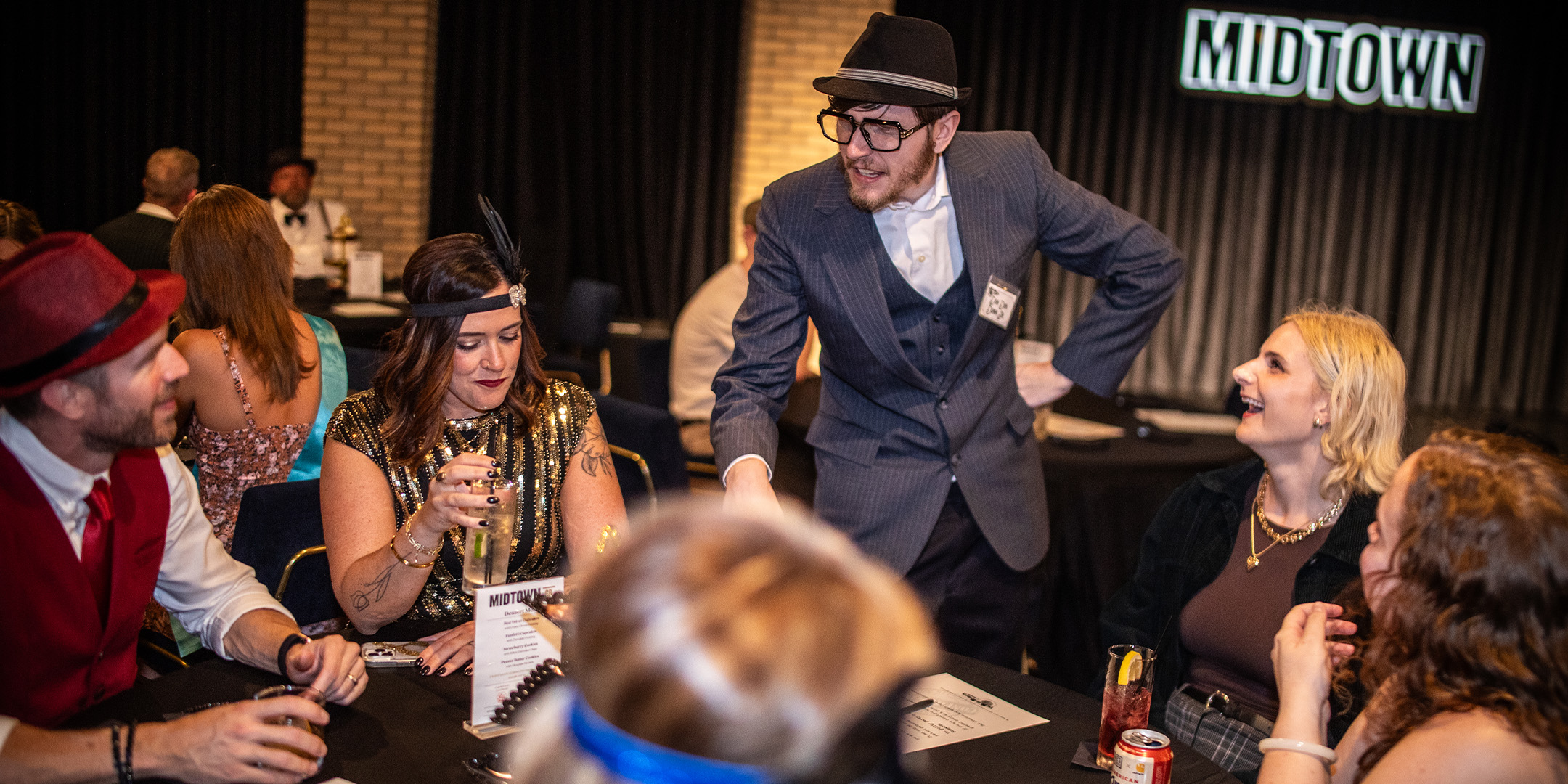 Guests at a Murder Mystery Company public dinner show in Los Angeles